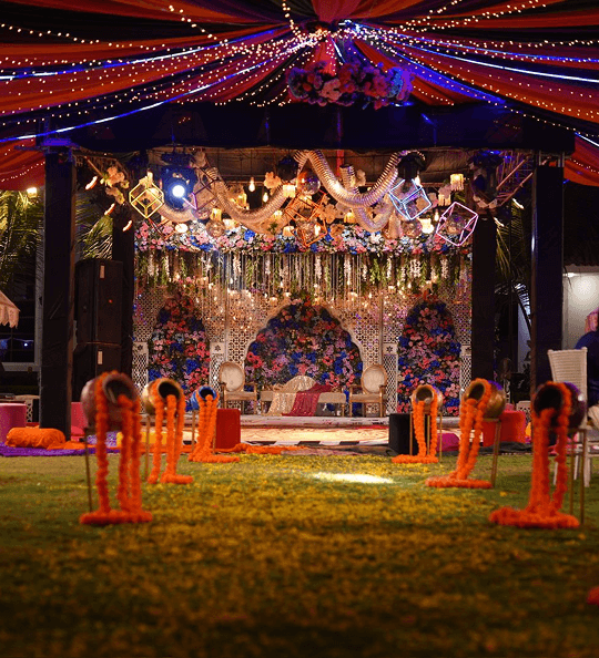 A beautifully decorated wedding ceremony featuring orange and yellow accents, enhancing the celebratory mood.